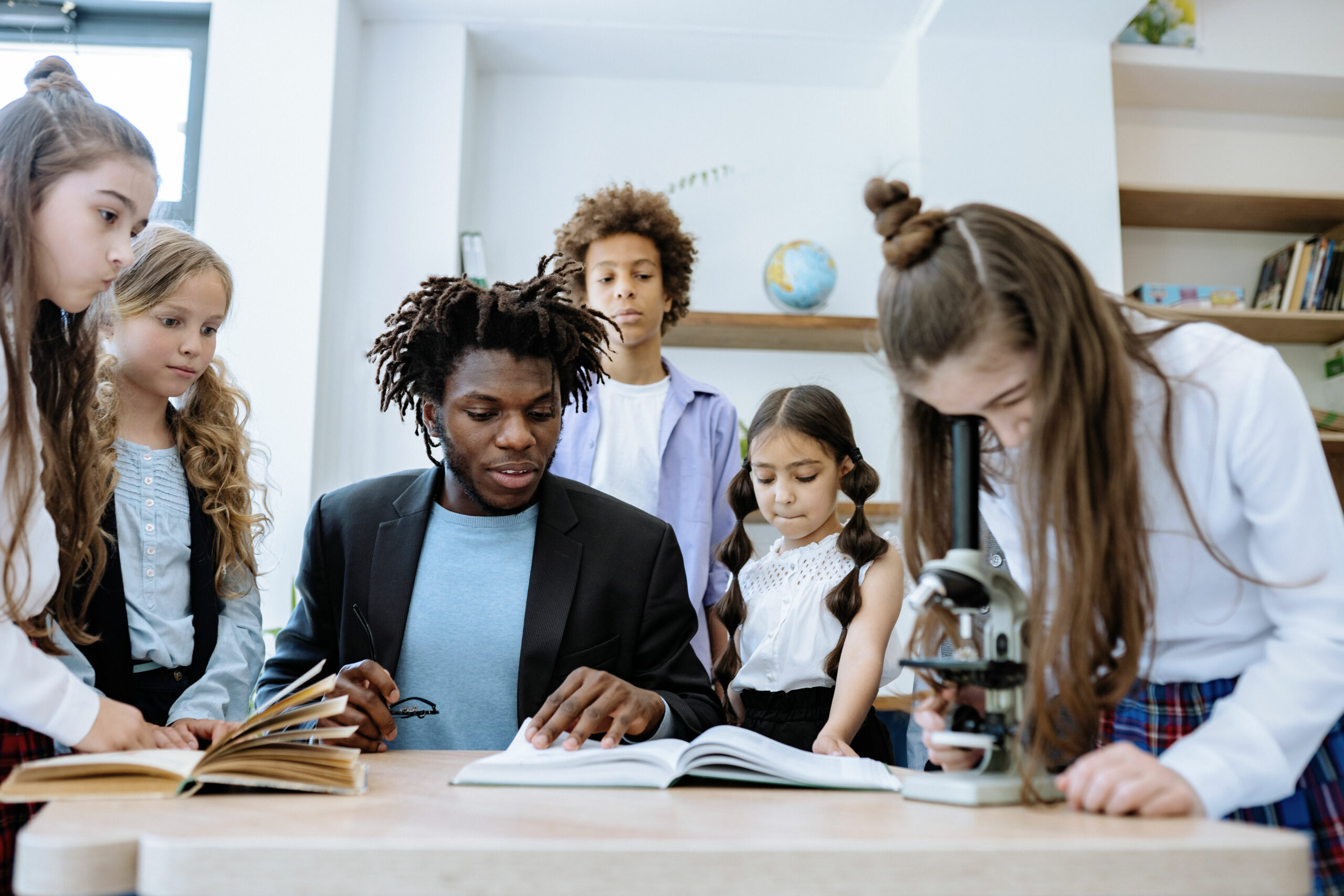 Teacher showing middle years students book